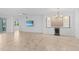 Expansive living room features neutral tones, recessed lighting, and a sleek wet bar at 14617 Sycamore Ct # 2211, Punta Gorda, FL 33955