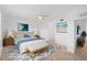 Cozy primary bedroom features neutral decor, a ceiling fan, and an ensuite bathroom at 14617 Sycamore Ct # 2211, Punta Gorda, FL 33955