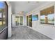 Screened patio with ceiling fan, TV, and a view of the beautiful pond at 14617 Sycamore Ct # 2211, Punta Gorda, FL 33955