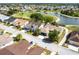 An aerial view of a cozy home nestled within a tranquil community, featuring lush green landscapes and serene waterways at 1872 Birmingham Blvd, Port Charlotte, FL 33980