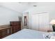 This bedroom offers neutral walls, a ceiling fan, and lots of closet space for storage at 1872 Birmingham Blvd, Port Charlotte, FL 33980