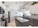 Modern kitchen with stainless steel appliances, granite countertops, and a center island at 1872 Birmingham Blvd, Port Charlotte, FL 33980