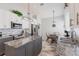 Modern kitchen featuring stainless steel appliances, granite countertops, island, and stylish cabinets at 1872 Birmingham Blvd, Port Charlotte, FL 33980