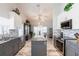 Modern kitchen with island, stainless steel appliances, and views to the open concept dining area at 1872 Birmingham Blvd, Port Charlotte, FL 33980
