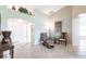 Bright living room features tile floors, ample natural light, and stylish furnishings at 1872 Birmingham Blvd, Port Charlotte, FL 33980