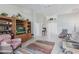 Cozy living room featuring vaulted ceilings, tile floors, and abundant natural light at 1872 Birmingham Blvd, Port Charlotte, FL 33980
