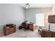 A spacious office with a work desk, filing cabinets, and neutral carpet makes this space functional at 1872 Birmingham Blvd, Port Charlotte, FL 33980