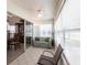 The sunroom with tile floor features sliding glass door, sitting area, view of the dining room at 1872 Birmingham Blvd, Port Charlotte, FL 33980