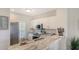 Kitchen features marble countertops, white cabinetry, and stainless steel appliances at 19325 Water Oak Dr # 305, Port Charlotte, FL 33948