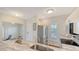 Well-lit kitchen featuring stainless steel appliances, stone countertops and white cabinetry at 19325 Water Oak Dr # 305, Port Charlotte, FL 33948