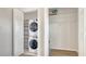 Laundry room with white washer and dryer, rack, shelving and laminate wood flooring at 19325 Water Oak Dr # 305, Port Charlotte, FL 33948