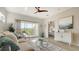 Bright living room with balcony access and open view to a tastefully decorated bedroom at 19325 Water Oak Dr # 305, Port Charlotte, FL 33948