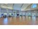 Large, inviting meeting room with a fireplace, wood floors, and plenty of natural light at 19325 Water Oak Dr # 305, Port Charlotte, FL 33948