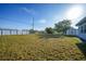 Spacious, grassy backyard with shed and surrounding neighborhood views at 22220 Lasalle Rd, Port Charlotte, FL 33952