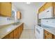 Well-lit kitchen featuring wood cabinets and modern appliances at 22220 Lasalle Rd, Port Charlotte, FL 33952