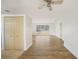 Open-concept living area with wood-look flooring and bright lighting at 22220 Lasalle Rd, Port Charlotte, FL 33952