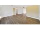 Spacious, bright room with wood-look flooring, and view to other rooms at 22220 Lasalle Rd, Port Charlotte, FL 33952