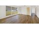 Bright living room featuring wood-look flooring and a large window at 22220 Lasalle Rd, Port Charlotte, FL 33952