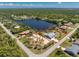 Beautiful aerial view of the property with the property lines, lake, and tropical surroundings at 2244 Meetze St, Port Charlotte, FL 33953