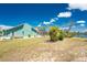 Home exterior with a screened-in lanai, set on a large lot with direct waterfront access at 2244 Meetze St, Port Charlotte, FL 33953