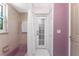 Bathroom with tile floor, bathtub with shower, and access door to the exterior of the home at 2244 Meetze St, Port Charlotte, FL 33953
