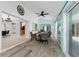 View from dining area leads to other living areas and offers backyard pool views through large sliding glass doors at 2244 Meetze St, Port Charlotte, FL 33953