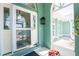 Inviting front entrance with decorative door, lantern, and well-kept landscaping at 2244 Meetze St, Port Charlotte, FL 33953