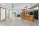 Bright and airy kitchen with an island, modern appliances, and a view to the pool, perfect for everyday living and entertaining at 2244 Meetze St, Port Charlotte, FL 33953