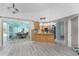 Spacious kitchen with an island, stainless appliances, and hardwood floors, blending style and functionality at 2244 Meetze St, Port Charlotte, FL 33953