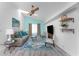 Living room featuring light blue accent walls, a comfortable sofa, and stylish décor, creating a welcoming and relaxing space at 2244 Meetze St, Port Charlotte, FL 33953