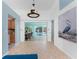Open living area with tile floors, art accents, and views of the pool, offering a seamless indoor-outdoor living experience at 2244 Meetze St, Port Charlotte, FL 33953