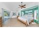 Bright main bedroom with a king bed, ensuite bath and pool views at 2244 Meetze St, Port Charlotte, FL 33953