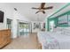 Spacious main bedroom with a king bed and view to the pool at 2244 Meetze St, Port Charlotte, FL 33953