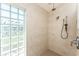 Walk-in shower features dual shower heads, neutral tile, and a glass block window for added light at 2244 Meetze St, Port Charlotte, FL 33953