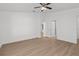 Bright bedroom with light-colored wood flooring and a modern ceiling fan at 2300 Nordendale Blvd, North Port, FL 34288