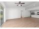 Bright, open-concept living room connected to a modern kitchen with stainless appliances at 2300 Nordendale Blvd, North Port, FL 34288