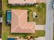 The aerial view of a well-maintained home includes a private pool in an enclosure and a manicured lawn at 2310 El Cerito Ct, Punta Gorda, FL 33950