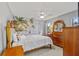 Bedroom with a mural of a beach and wooden furniture at 2310 El Cerito Ct, Punta Gorda, FL 33950