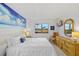 Bedroom featuring a mural of a beach and water views from the window at 2310 El Cerito Ct, Punta Gorda, FL 33950