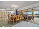 Elegant dining room with seating for six, seamlessly connected to an outdoor screened lanai at 2310 El Cerito Ct, Punta Gorda, FL 33950