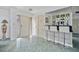 Inviting home entrance featuring stylish marble flooring, a wet bar and ample closet space at 2310 El Cerito Ct, Punta Gorda, FL 33950