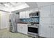 Kitchen featuring stainless steel appliances and a mosaic backsplash at 2310 El Cerito Ct, Punta Gorda, FL 33950