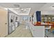 Bright kitchen with stainless steel appliances and a wooden breakfast bar with seating overlooking the water at 2310 El Cerito Ct, Punta Gorda, FL 33950
