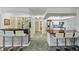 Spacious kitchen with marble floors, a wet bar, and ample countertop seating at 2310 El Cerito Ct, Punta Gorda, FL 33950