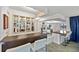 Bright kitchen with stainless steel appliances, a unique backsplash, and counter seating at 2310 El Cerito Ct, Punta Gorda, FL 33950