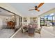 Covered patio with dining and cooking spaces overlooking the canal at 2310 El Cerito Ct, Punta Gorda, FL 33950