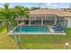 A screened-in pool and covered lanai area make the backyard perfect for entertaining and relaxing at 2310 El Cerito Ct, Punta Gorda, FL 33950