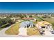 Aerial view of a single Gathering home in a residential community with a neighboring home under construction at 24294 Santa Inez Rd, Punta Gorda, FL 33955
