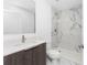 Bathroom featuring modern vanity, marble tile shower and marble tile floors at 24294 Santa Inez Rd, Punta Gorda, FL 33955