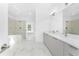 A Primary bathroom offers marble floors, double sinks, a bathtub, and shower at 24294 Santa Inez Rd, Punta Gorda, FL 33955